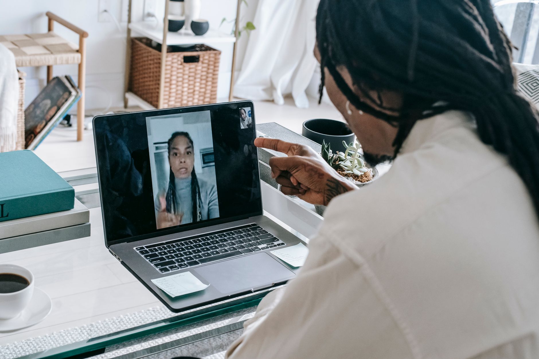 Angry African American couple having video call via modern netbook and arguing in misunderstanding